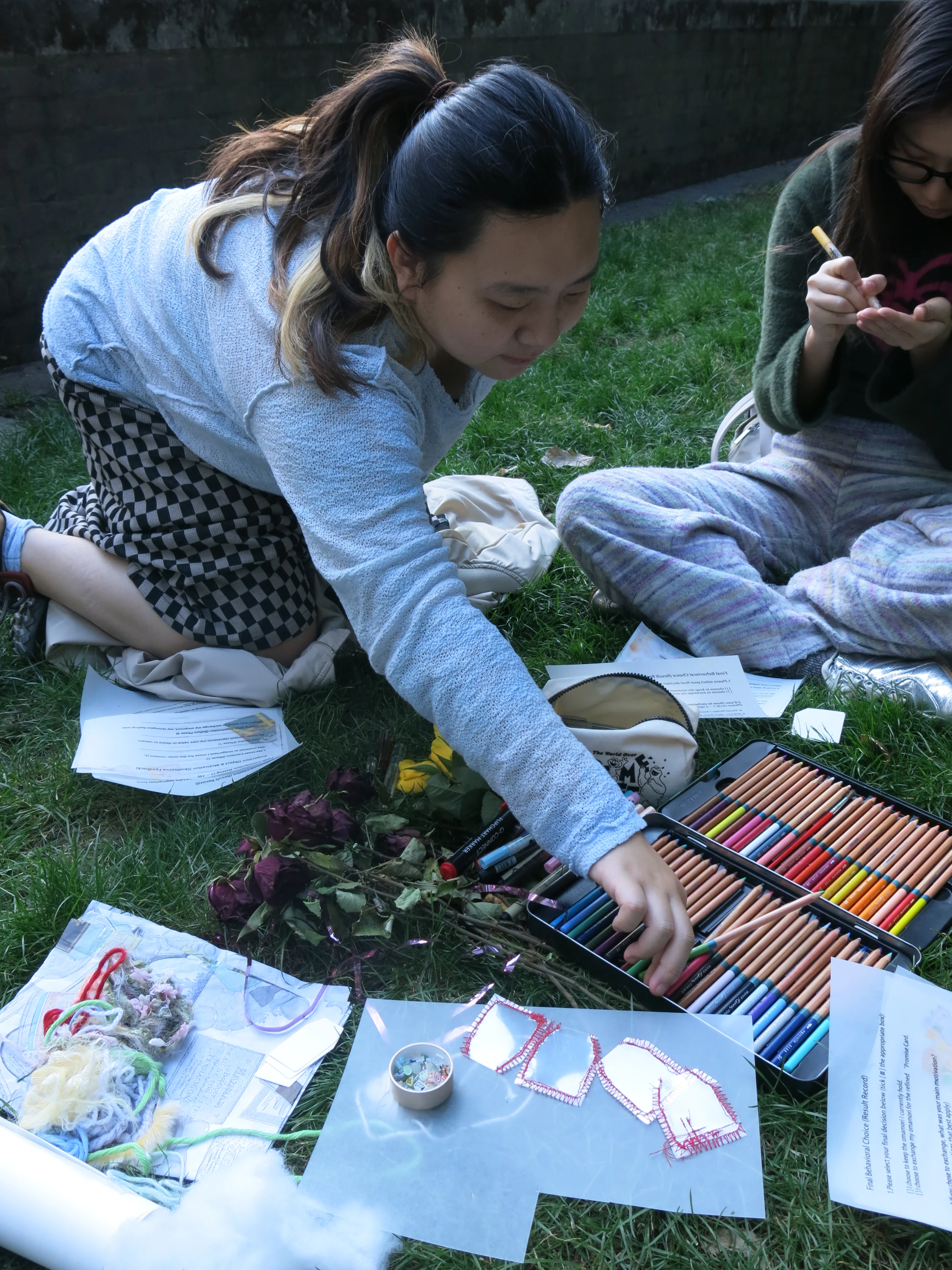 Workshop participant reaching for materials